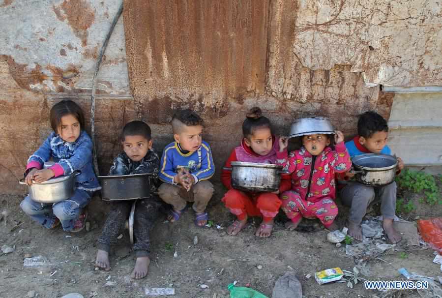 Palestinian woman in Gaza shares donated money by cooking food for hungry neighbors