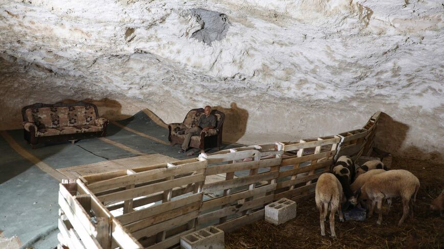 Farming families in West Bank retreat to caves as settlers encircle land